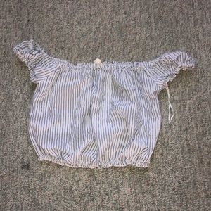 white and blue off the should shirt